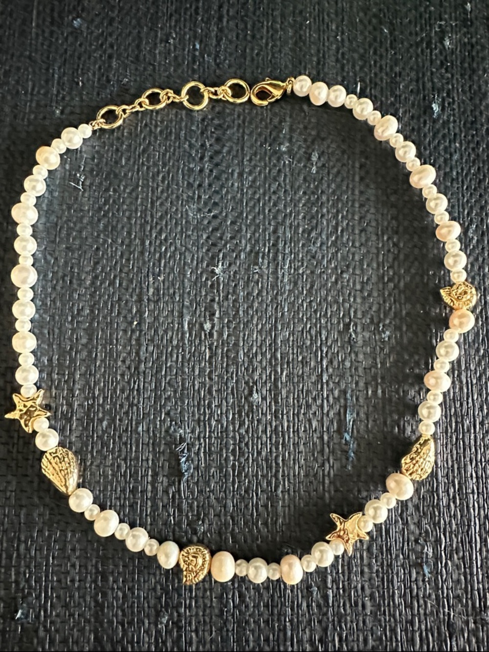 Pearl and gold charm necklace